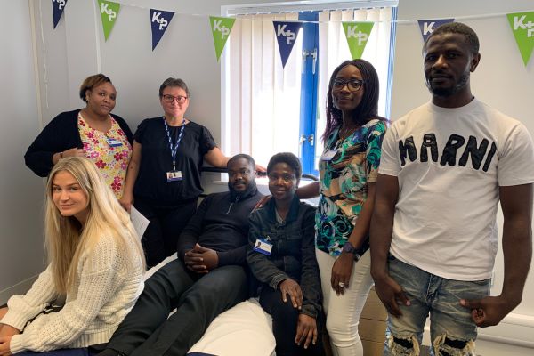 Photograph showing the carers and staff members who have taken part in the first new Kare Plus moving and handling training session, including the trainer.