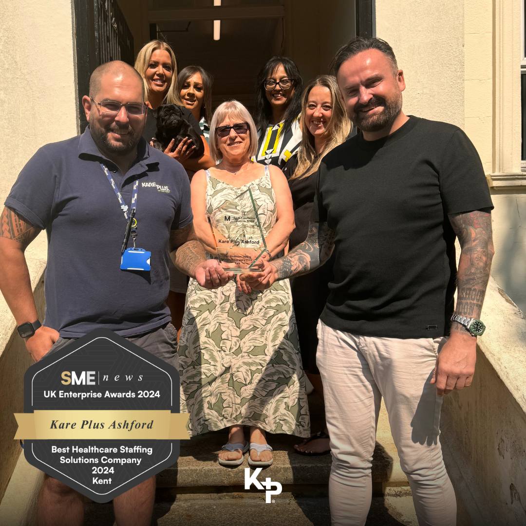 Kare Plus Ashford case study image with a photo of the team receiving an award in 2024.